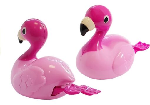 Roosa ujuv flamingo - h&otilde;ljub vee peal ja liigutab jalgu