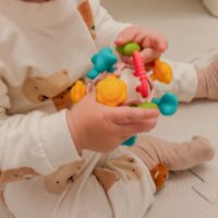 Woopie spalvota kamuoliuko formos barškutė 4in1