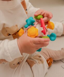 Woopie spalvota kamuoliuko formos barškutė 4in1